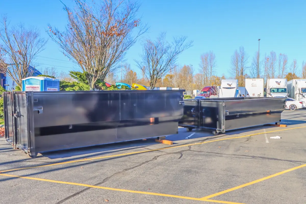 Professional dumpster rental service with roll-off container on residential driveway in Skidaway Island